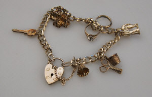 Appraisal: Silver curb charm bracelet with padlock having six various charms