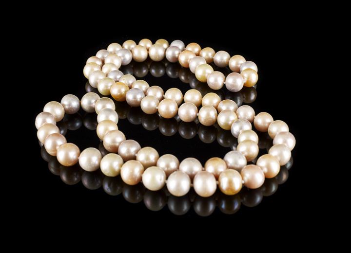 Appraisal: Unusual Opera-Length Continuous Strand of Pastel Cultured Pearls of spherical