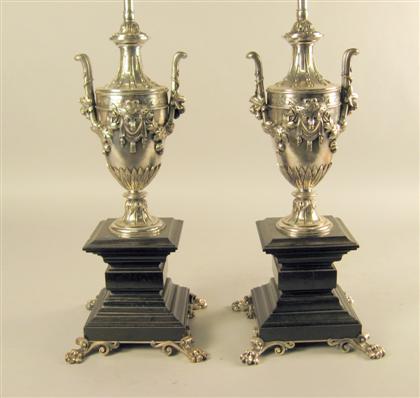 Appraisal: Pair of neoclassical style silvered bronze lamps th century H