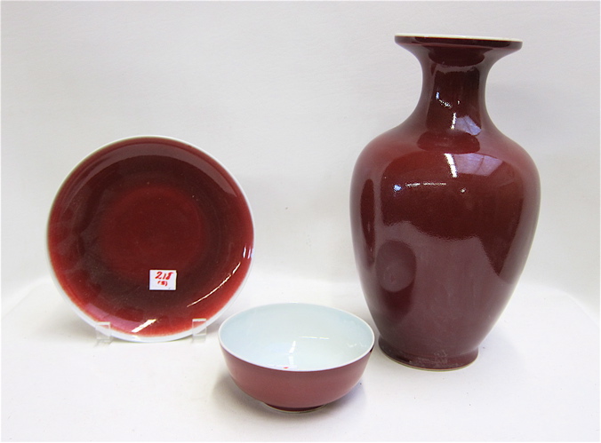 Appraisal: THREE CHINESE PORCELAIN PIECES in a red glaze a vase