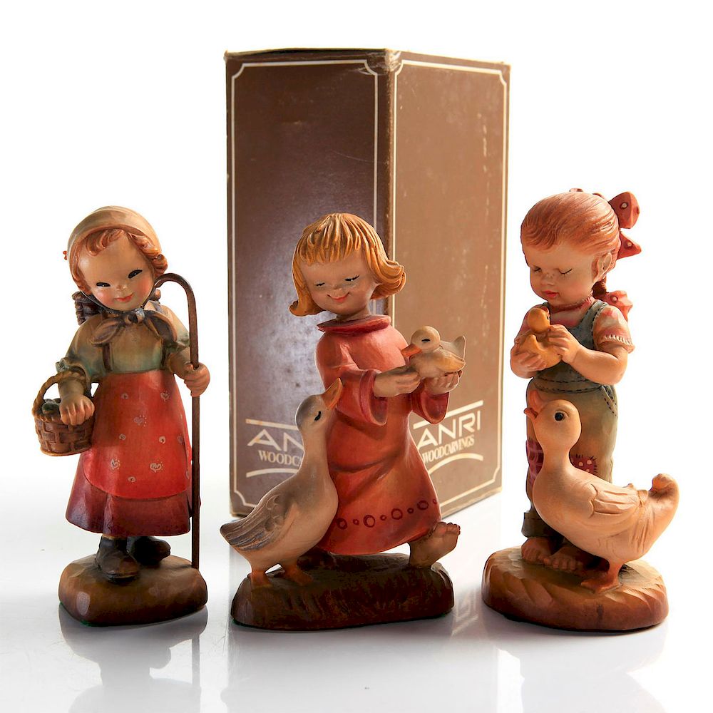 Appraisal: ANRI WOODCARVING FIGURINES signed hand-carved wooden figures from Italy The