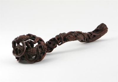 Appraisal: A Chinese hardwood sceptre carved with a reticulated fruiting vine