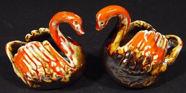 Appraisal: Pair of Eric Leaper pottery swan vases decorated in a