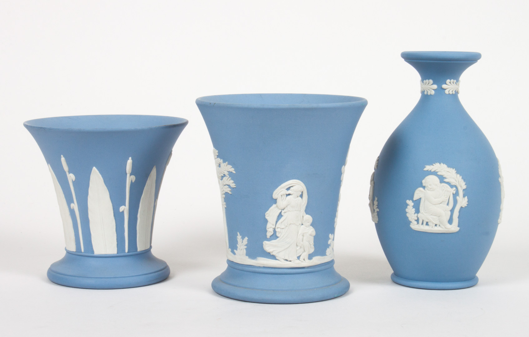 Appraisal: Three Wedgwood blue and white jasperware vases two with classical