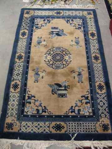 Appraisal: Chinese Handmade Rug objects on fan field blue ivory trim