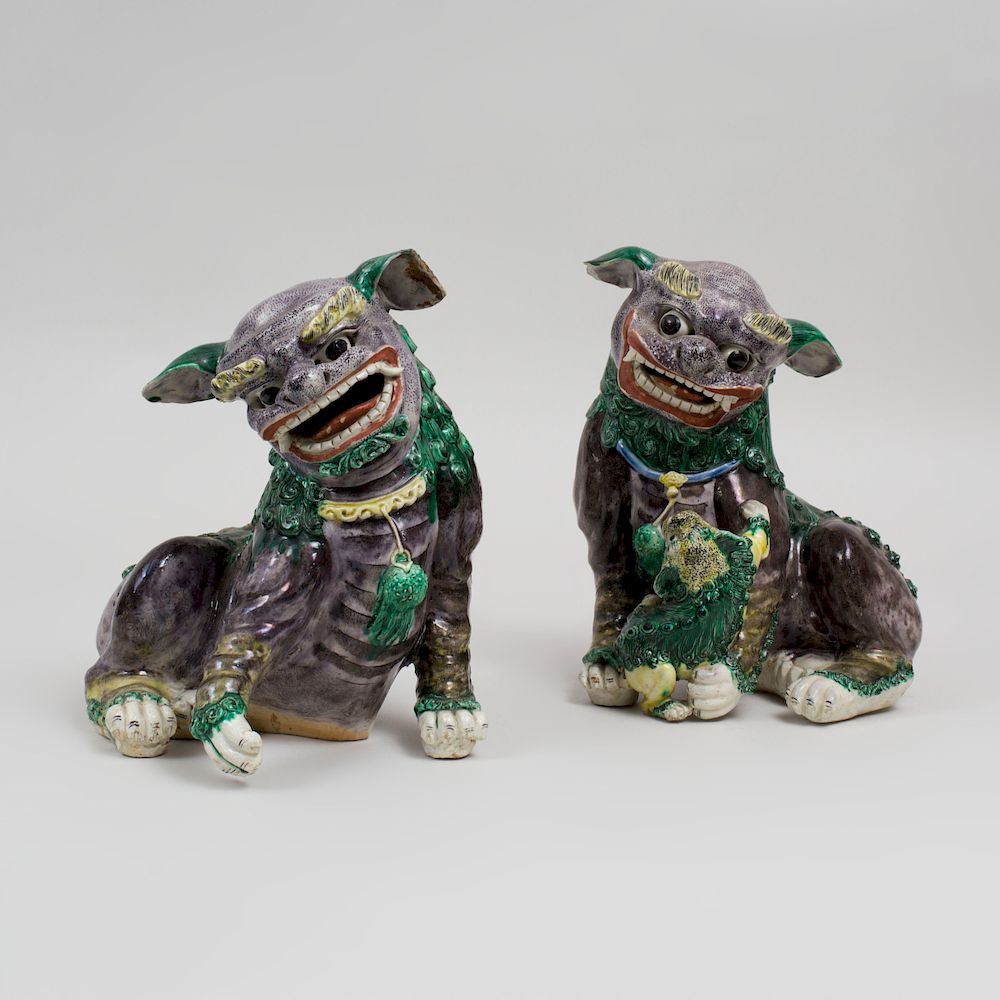 Appraisal: Pair of Chinese Aubergine Green and Yellow Glazed Porcelain Models