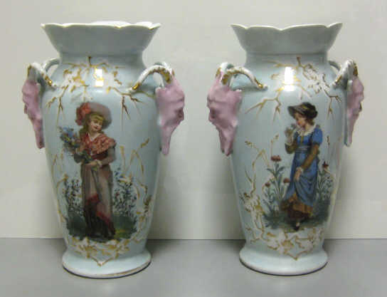 Appraisal: PAIR OF GERMAN PORCELAIN VASES Each with two applied horned