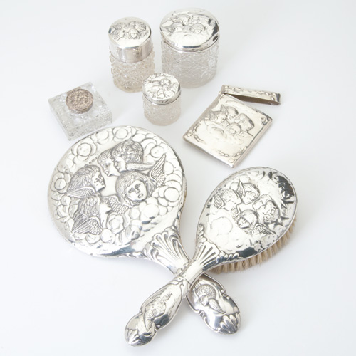 Appraisal: English silver assembled seven-piece dresser set each piece with repouss