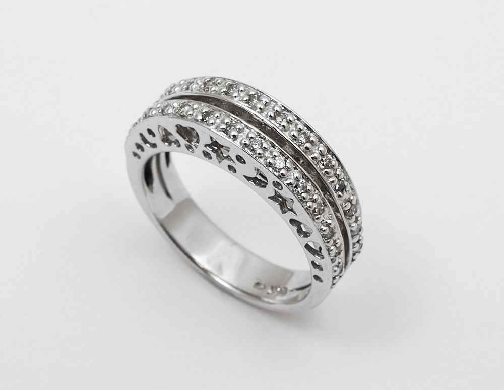 Appraisal: DIAMOND BAND RING K white gold moon and star filigree