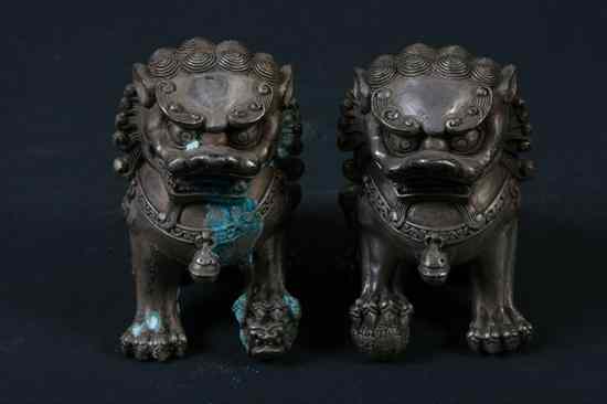 Appraisal: PAIR CHINESE SILVERED FIGURES OF FU DOGS - in high