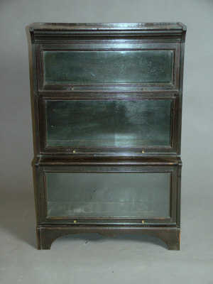 Appraisal: A dark oak 'Globe Wernicke' style three division bookcase th