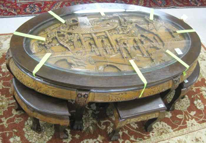 Appraisal: SEVEN-PIECE CARVED WOOD LOW TABLE AND STOOL SET Chinese th