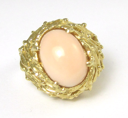 Appraisal: PINK CORAL AND FOURTEEN KARAT GOLD SOLITAIRE RING having four