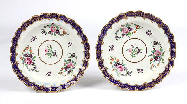 Appraisal: A PAIR OF FIRST PERIOD WORCESTER PORCELAIN PLATES with polychrome