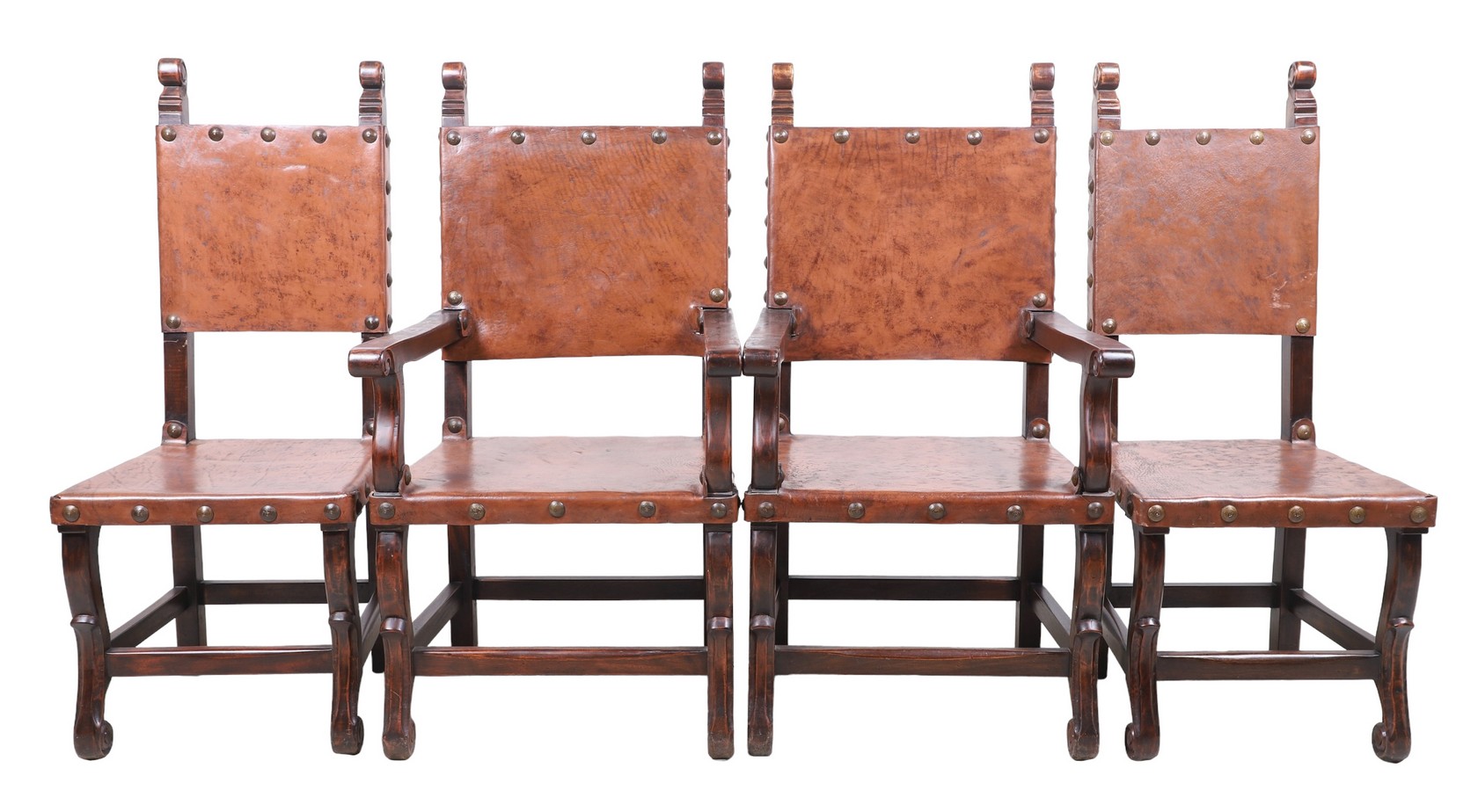 Appraisal: South Cone carved leather dining chairs scrolled top over tacked