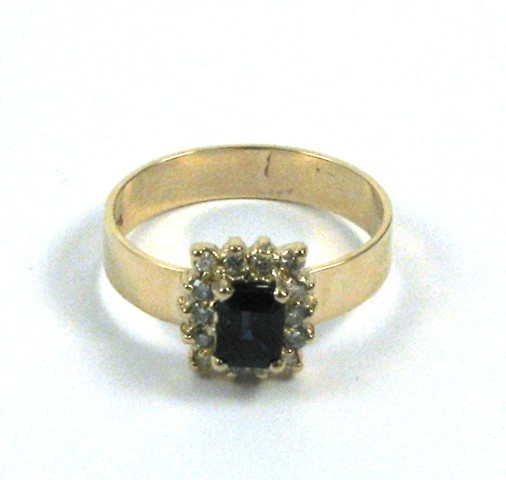 Appraisal: SAPPHIRE DIAMOND AND FOURTEEN KARAT GOLD RING centering an emerald-cut