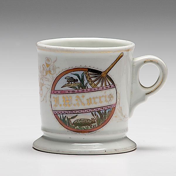 Appraisal: KOKEN DECORATED SHAVING MUG porcelain with interesting polychrome scene of