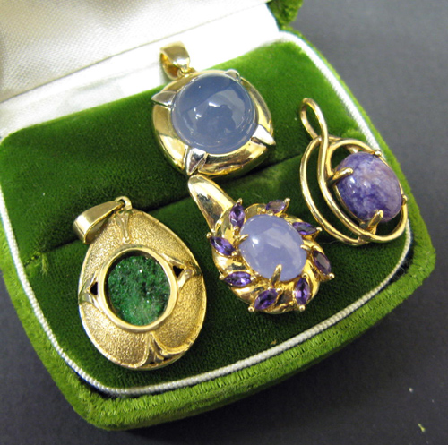 Appraisal: FOUR GEMSTONE AND YELLOW GOLD PENDANTS including purple chalcedony purple