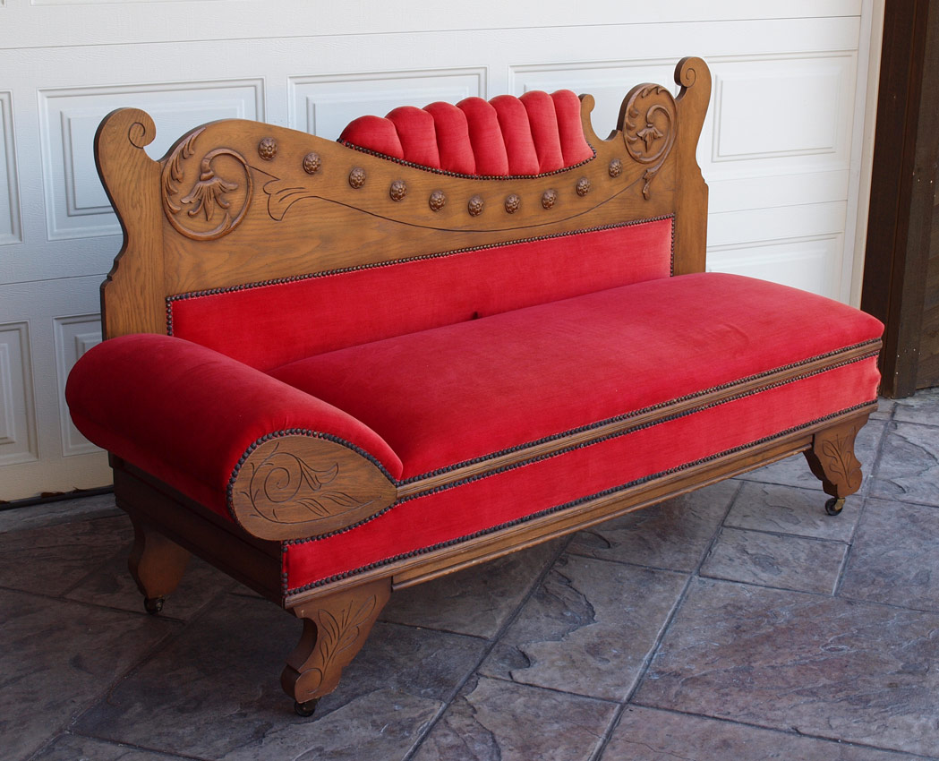 Appraisal: GOLDEN OAK CHAISE LOUNGE CONVERTS TO BED Carved and shaped