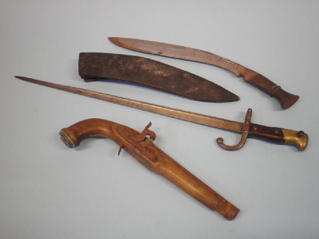 Appraisal: A percussion pistol with a walnut stock kukri and a