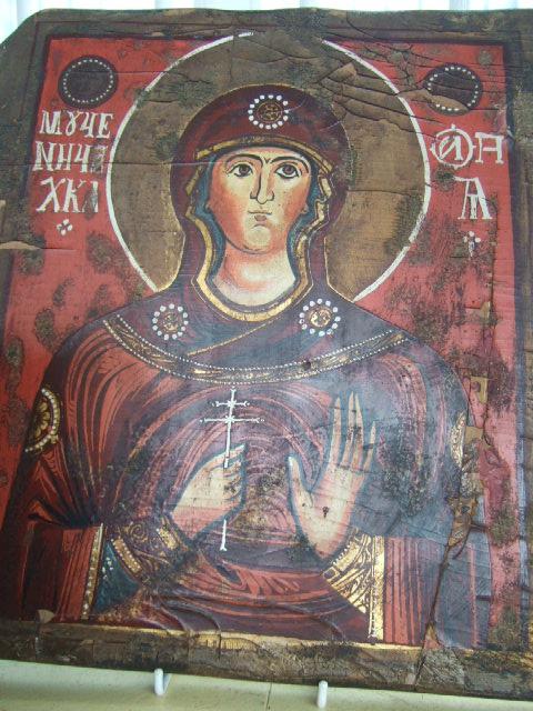 Appraisal: A Russian Icon depicting a martyr wearing a red apron