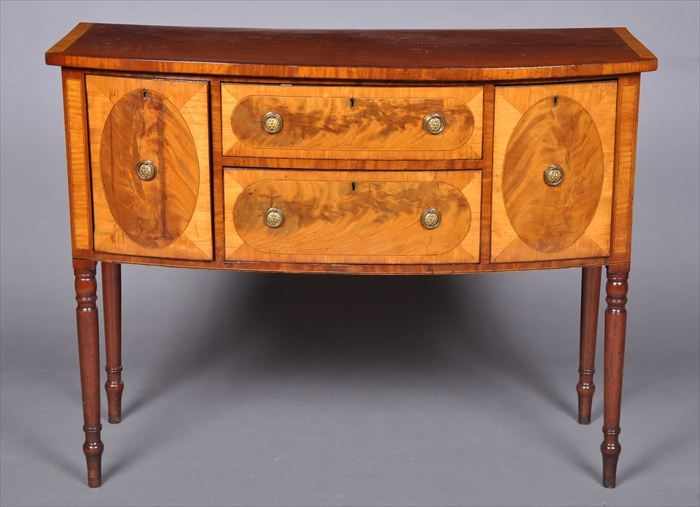 Appraisal: GEORGE III-STYLE SATINWOOD-INLAID MAHOGANY BOW-FRONTED SIDEBOARD The line-inlaid cross-banded top