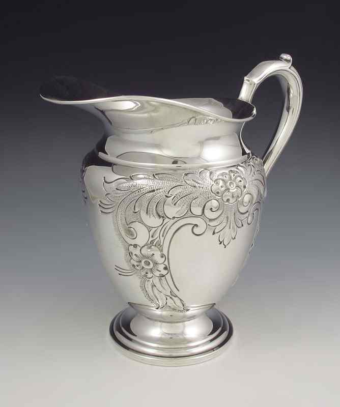 Appraisal: WHITING HAND CHASED STERLING PITCHER Hand chased with floral design