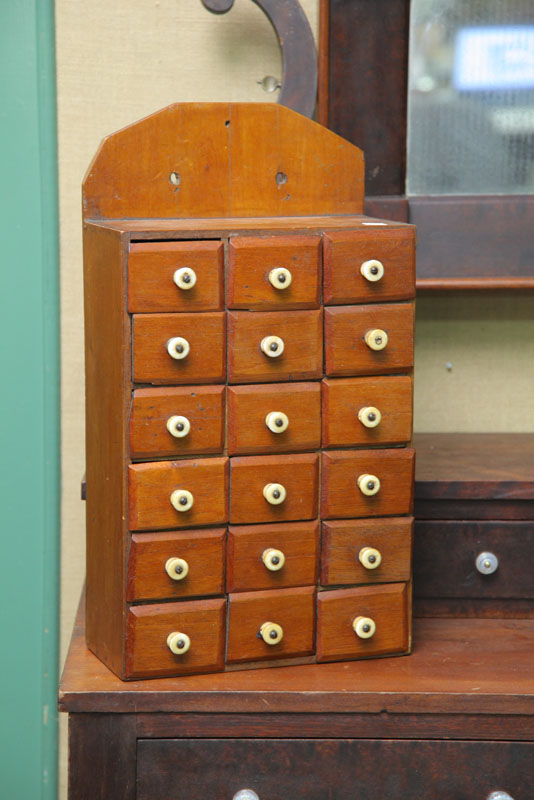 Appraisal: HANGING SPICE CABINET Walnut having a shaped crest and eighteen