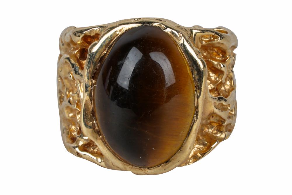 Appraisal: KARAT YELLOW GOLD TIGER'S EYE RINGcentering one oval cabochon tiger's