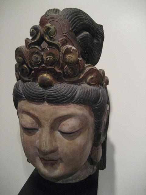 Appraisal: A Chinese polychromed wood head of Guanyin th century With