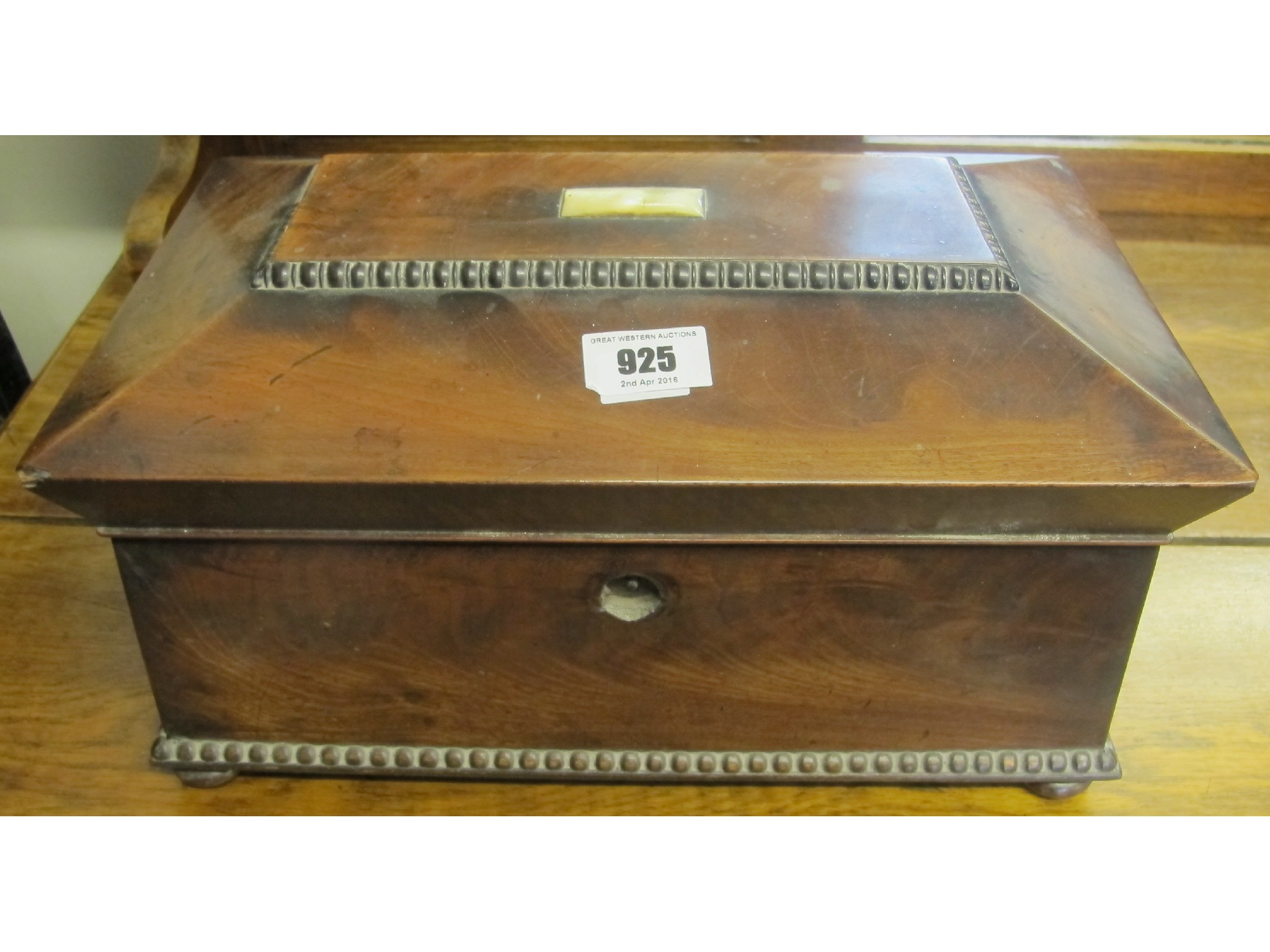 Appraisal: A mahogany sarcophagus tea caddy casket with mother of pearl