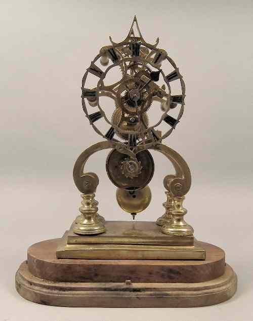 Appraisal: A brass framed ''Skeleton'' clock the ins silvered dial with