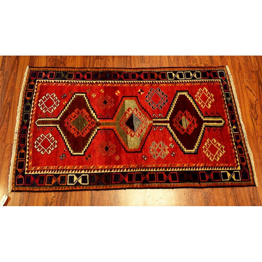 Appraisal: Persian Area Rug Persian Area Rug Multi colored patterns on