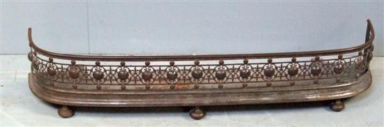 Appraisal: th century bow fronted iron fender with pierced scrolling decoration