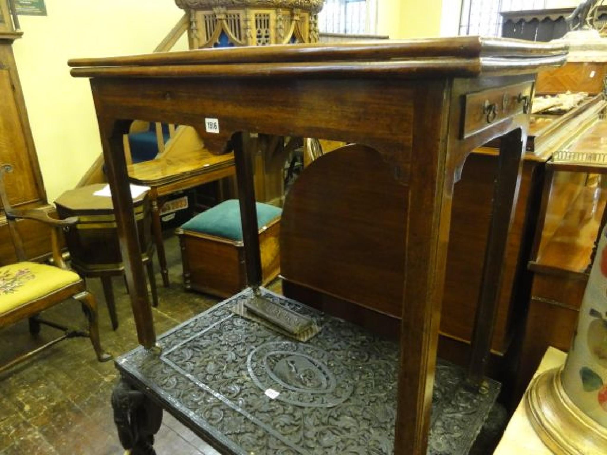 Appraisal: A Georgian mahogany fold over top tea table of rectangular