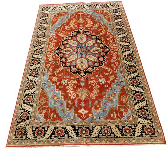 Appraisal: RUG Serapi scatter rug red field with light blue cornerpieces