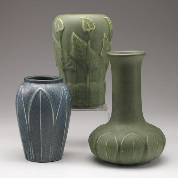 Appraisal: HAMPSHIRE Three matte vases with leaves two green and one