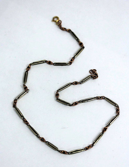 Appraisal: A BI-COLOURED GOLD CHAIN cm long