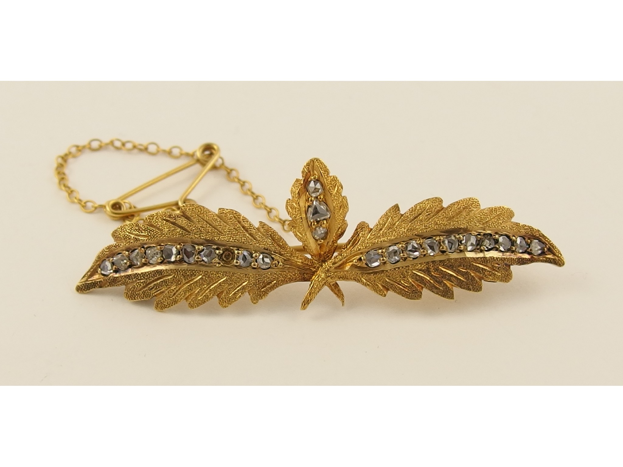 Appraisal: A yellow metal rose cut diamond set leaf brooch