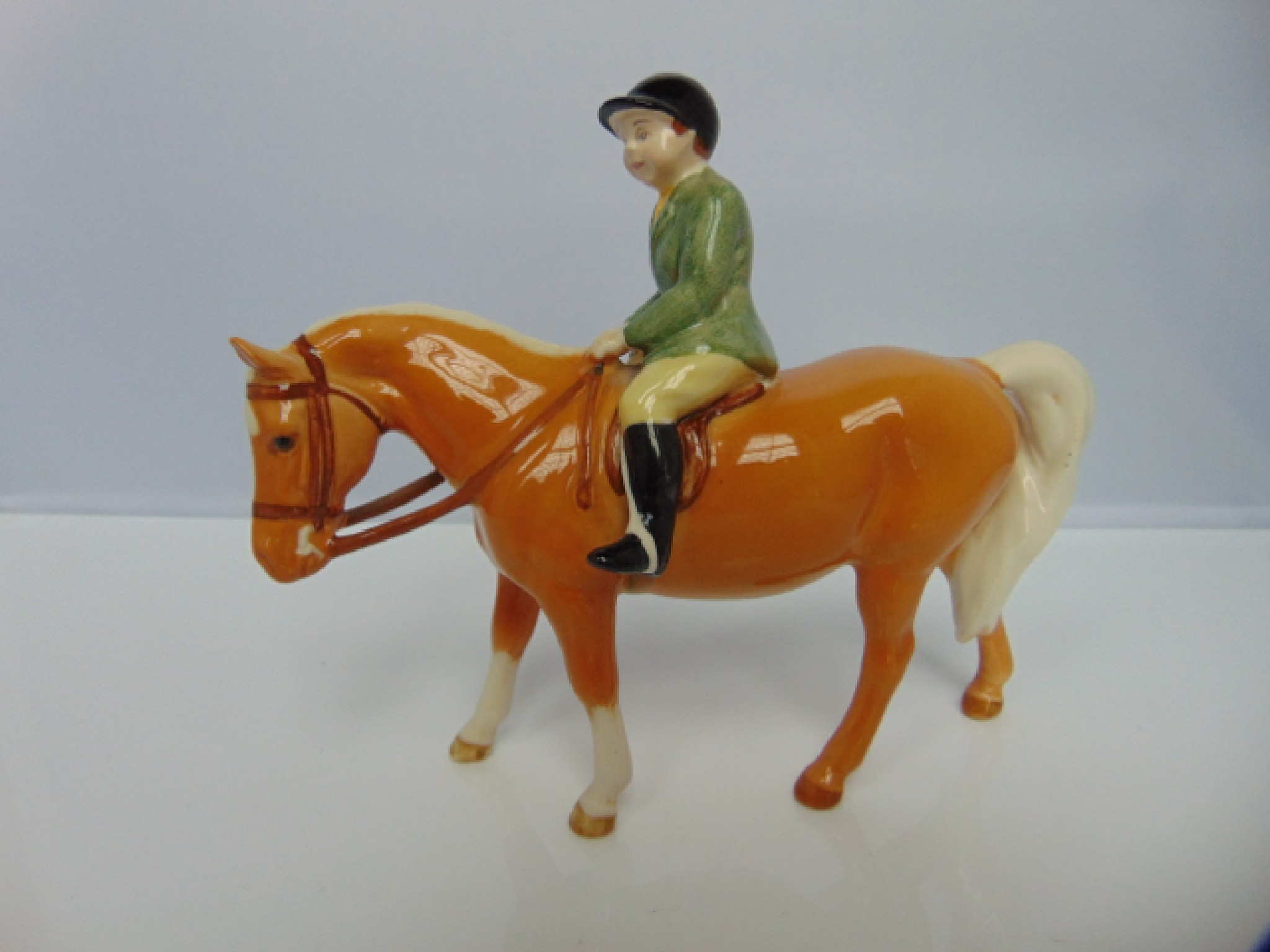 Appraisal: A Beswick model of a Palomino pony with green jacketed