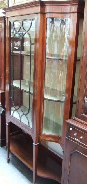 Appraisal: An Edwardian mahogany and satinwood banded breakfront display cabinet the