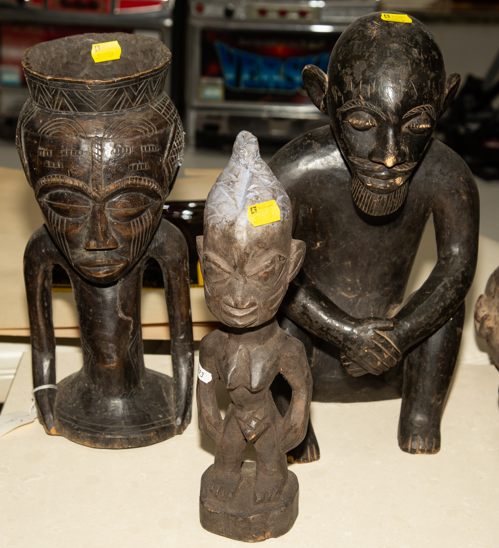 Appraisal: SIX AFRICAN ARTWORKS Including a cast bronze covered urn from