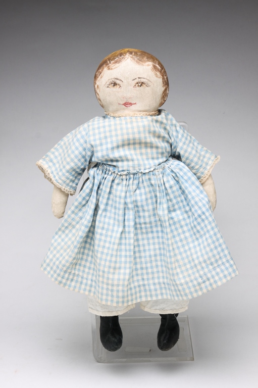 Appraisal: PRESBYTERIAN OIL CLOTH DOLL Ca - Possibly original blue dress