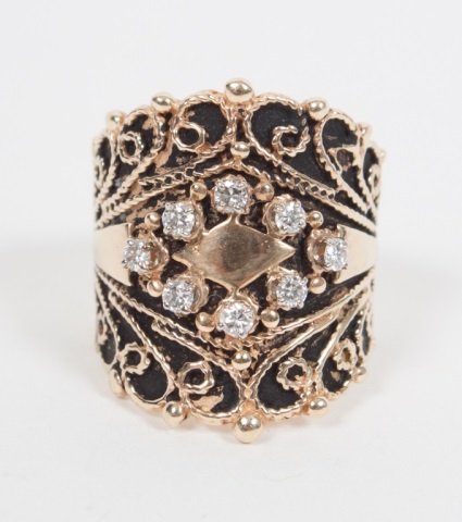 Appraisal: Lady's K gold filigree and diamond dinner ring presenting eight