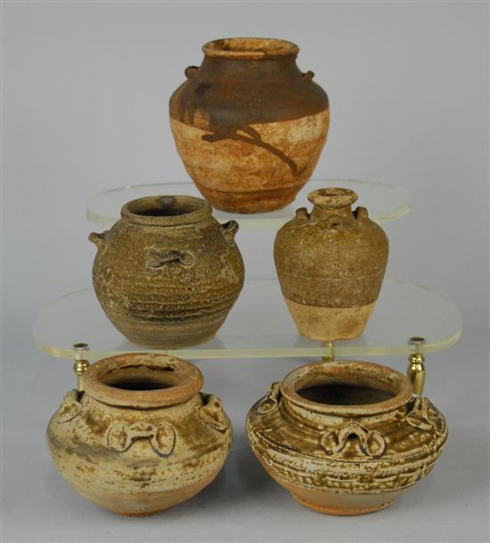 Appraisal: FIVE SMALL CHINESE RUSTIC EARTHENWARE VESSELS with lugs height of