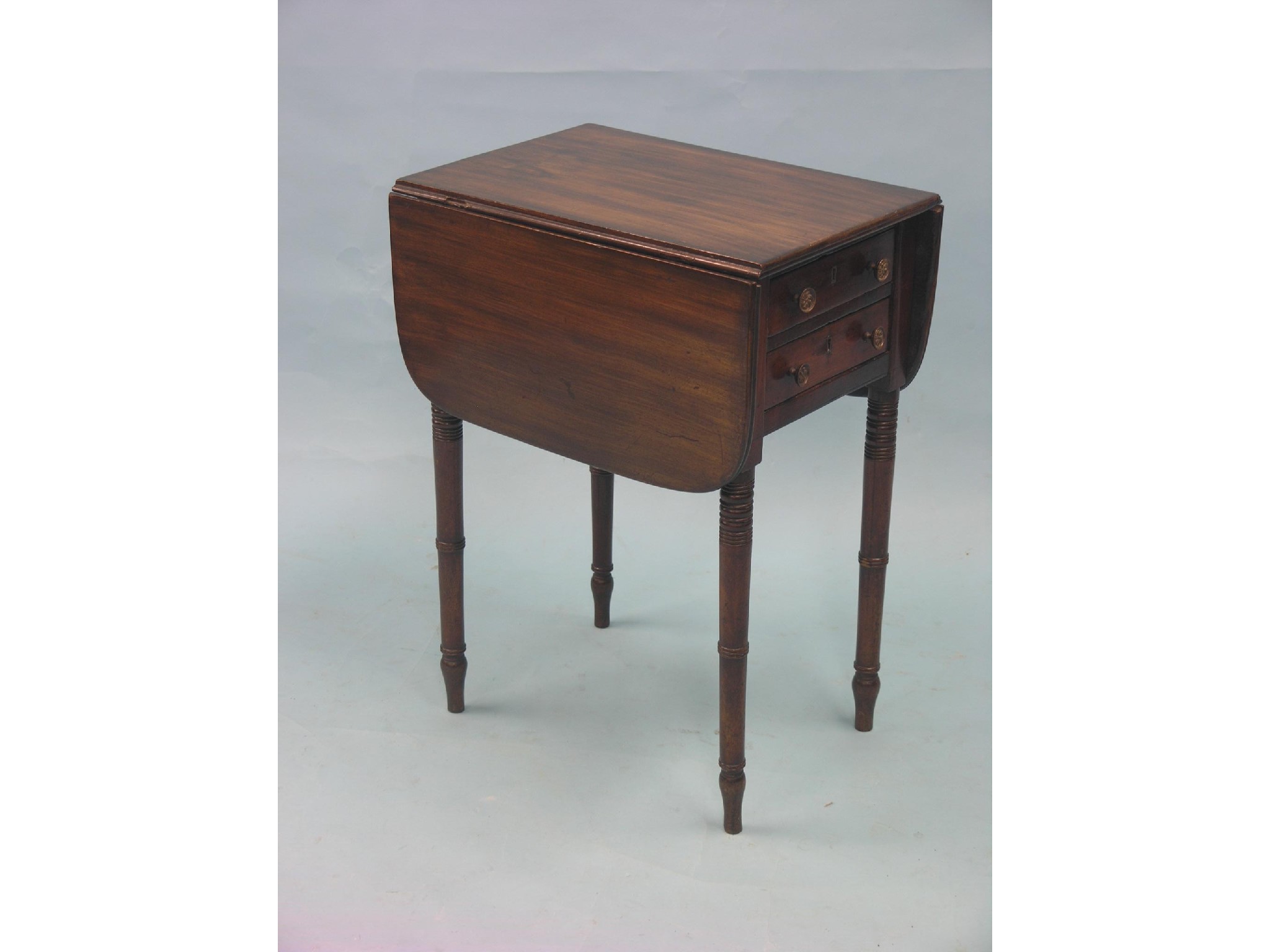 Appraisal: A Victorian mahogany drop-leaf work table with two drawers on