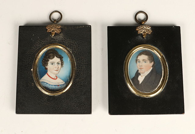 Appraisal: A PAIR OF EARLY TH CENTURY PORTRAIT MINIATURES of husband