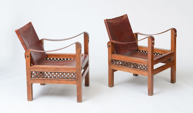 Appraisal: PAIR OF SAFARI STYLE LEATHER AND STAINED BEECH ARMCHAIRS With