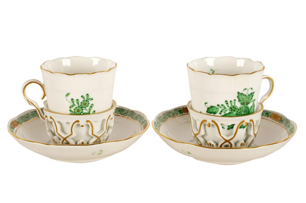 Appraisal: PAIR OF HEREND PORCELAIN CUPS SAUCERSgreen 'Chinese Bouquet' pattern printed