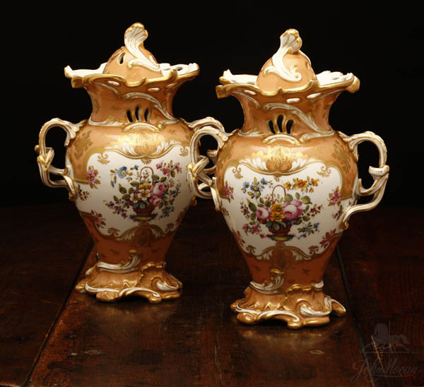 Appraisal: A pair of Rockingham porcelain covered vases A pair of